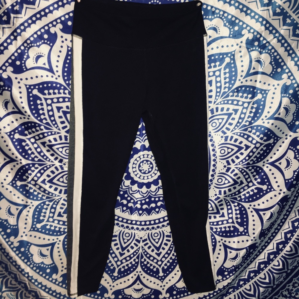 Black leggings with grey and white stripes on side